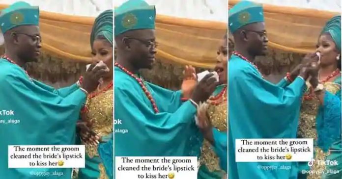 Groom wipes off his bride's lipstick. Photo credit: @oppyjay_alaga Groom wipes off his bride's lipstick. Photo credit: @oppyjay_alaga
