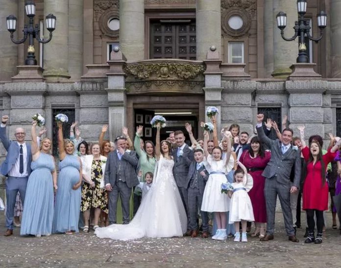 The couple and their friends and family on the big day ( Image: Clarity Wedding Photography / SWNS) (Copy) The couple and their friends and family on the big day ( Image: Clarity Wedding Photography / SWNS)