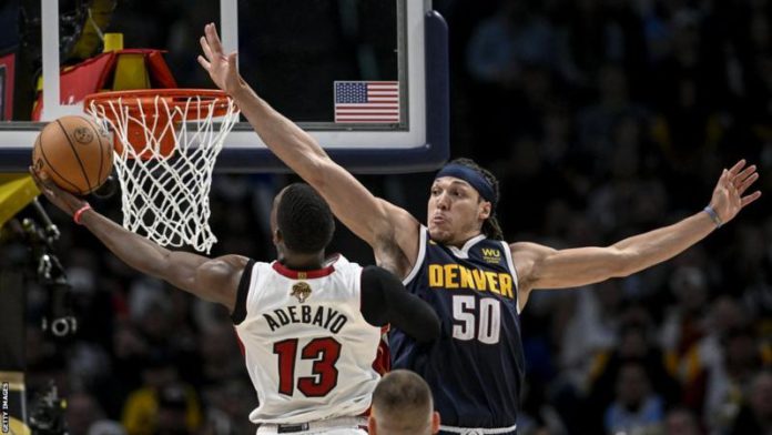 Aaron Gordon tries to block Bam Adebayo's effort Aaron Gordon tries to block Bam Adebayo's effort