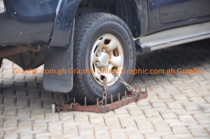 The financial officer’s official vehicle the clamped tyre The financial officer’s official vehicle the clamped tyre