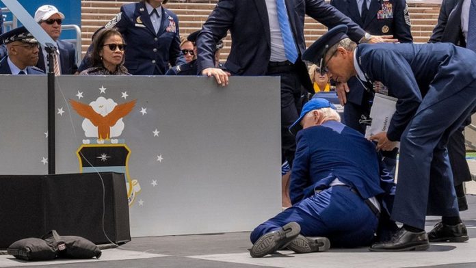 US President Joe Biden trips and falls during US Airforce graduation ceremony US President Joe Biden trips and falls during US Airforce graduation ceremony