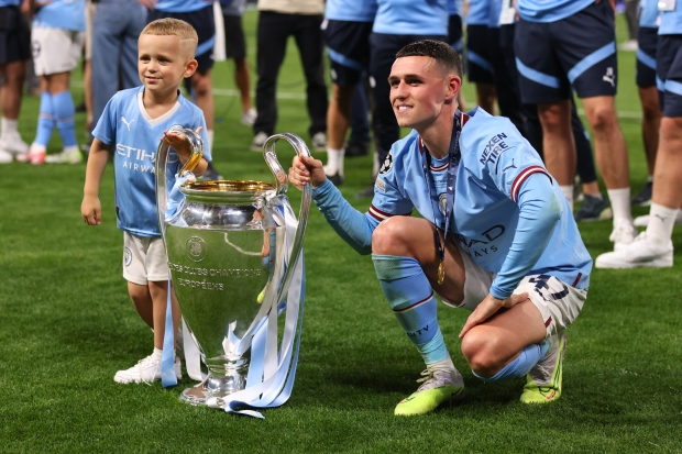 Foden and son Ronnie starred in Man City's treble celebrations Credit: Getty Foden and son Ronnie starred in Man City's treble celebrations Credit: Getty