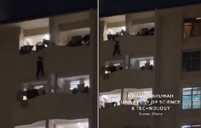 KNUST suicide The victim hanging on the building while his colleagues are trying to save him