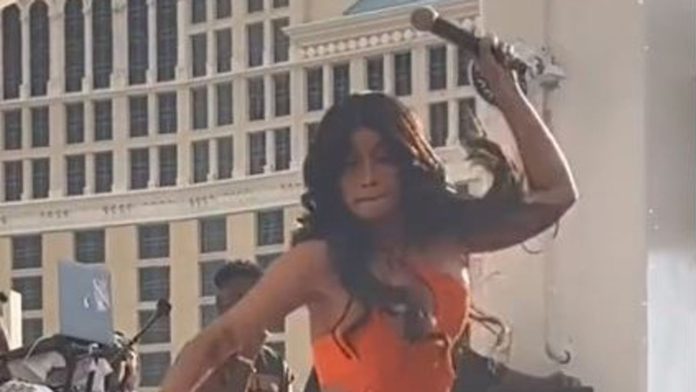 Cardi B hurls microphone at fan for splashing drink on her while performing