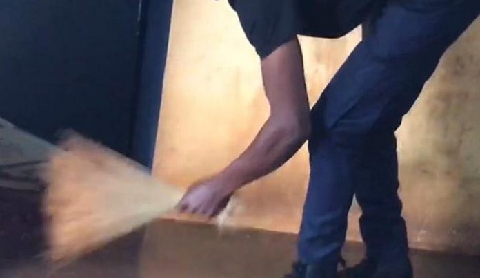 police officer sweeping