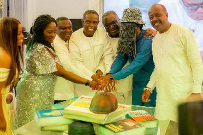 Kwesi Pratt Jnr (fourth left) cuts his 70th birthday cake with wellwishers Kwesi Pratt Jnr (fourth left) cuts his 70th birthday cake with wellwishers