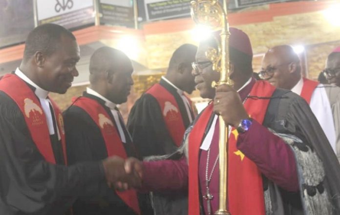 Most Rev. Paul Kwabena Boafo (with a staff in hand), ordaining the priests at the ceremony Most Rev. Paul Kwabena Boafo (with a staff in hand), ordaining the priests at the ceremony
