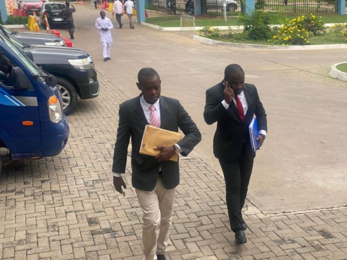 One of the witnesses, Sup. Eric Gyebi arrives with his lawyer. One of the witnesses, Sup. Eric Gyebi arrives with his lawyer.