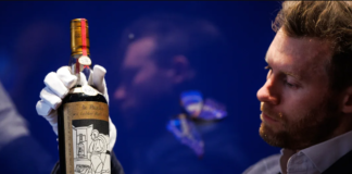 Jonny Fowle, Sotheby's global head of whisky, unveils a bottle of The Macallan 1926, the world's most expensive whisky on October 19, 2023 in London, England.