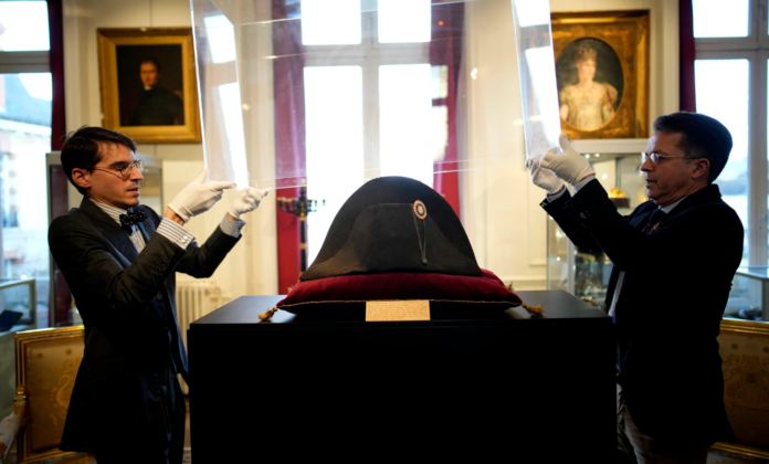The broad black hat that Napoleon wore when he ruled 19th-century France and waged war in Europe fetched more than $2 million at auction on Sunday. Christophe Ena/AP The broad black hat that Napoleon wore when he ruled 19th-century France and waged war in Europe fetched more than $2 million at auction on Sunday. Christophe Ena/AP