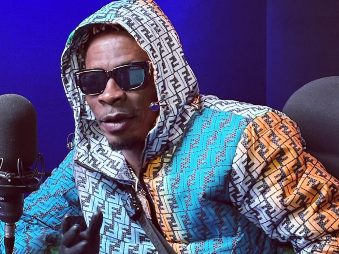 Shatta Wale Shatta Wale looking into the camera in a studio | photo credit: @ghkwaku/Instagram