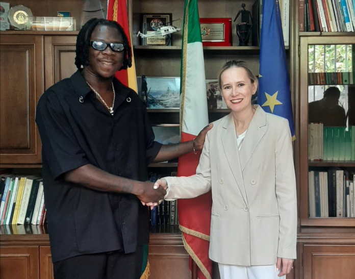 Stonebwoy shaking Italy Ambassador, Daniela d'Orlandi