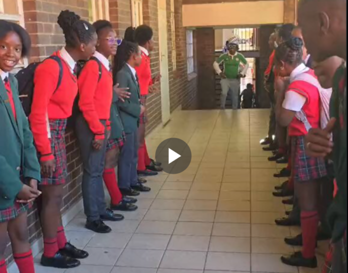 South African students welcome their Nigerian Teacher with a guard of honour, after Nigeria beat South Africa in the AFCON. South African students welcome their Nigerian Teacher with a guard of honour, after Nigeria beat South Africa in the AFCON.