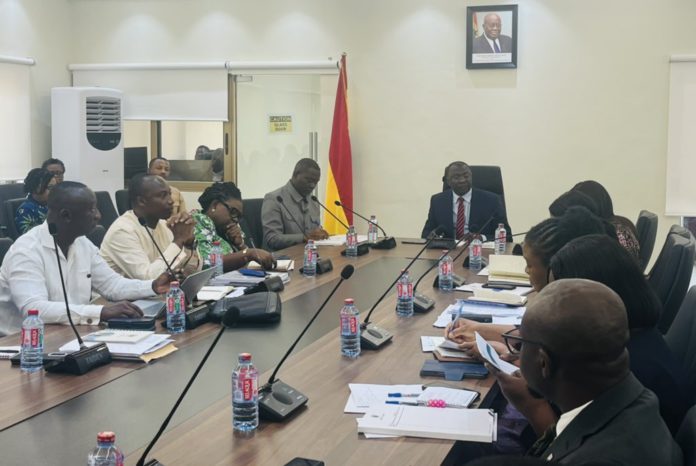 Amin Adam interacts with the Ministry of Finance staff