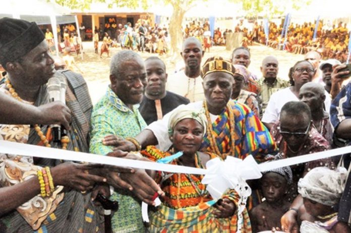 Kofi Dzamesi (2nd from left), CEO of Bui Power Authority, being assisted by some traditional rulers to perform the tape-cutting ceremony. Inset: The new classroom block Kofi Dzamesi (2nd from left), CEO of Bui Power Authority, being assisted by some traditional rulers to perform the tape-cutting ceremony. Inset: The new classroom block