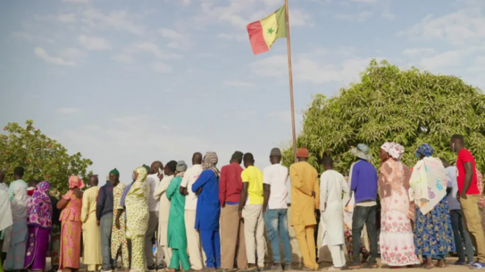 Seven million people, some seen here queuing in Ndiaganiao, are eligible to vote (BBC)