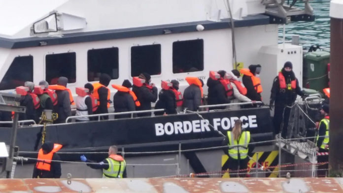 Migrants being brought ashore at Dover on Saturday