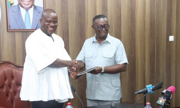 Andy Appiah Kubi (right), Chairman of the Devesting Committee and Member of Parliament for Asante-Akim North Constituency, presenting the report to Samuel Abu Jinapor (left), Minister of Lands and Natural Resources, after the meeting with the committee. Picture: ELVS NII NOI DOWUONA Andy Appiah Kubi (right), Chairman of the Devesting Committee and Member of Parliament for Asante-Akim North Constituency, presenting the report to Samuel Abu Jinapor (left), Minister of Lands and Natural Resources, after the meeting with the committee. Picture: ELVS NII NOI DOWUONA