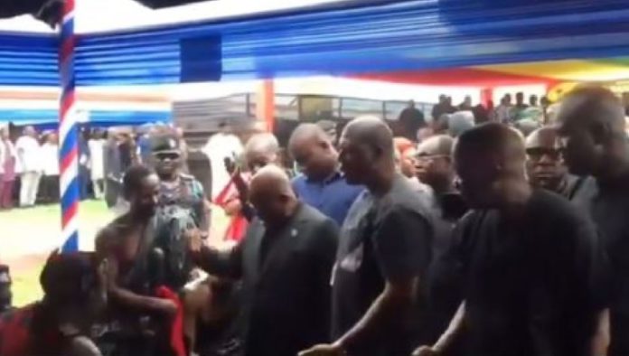 President Akufo-Addo instructing a chief to rise up and greet him
