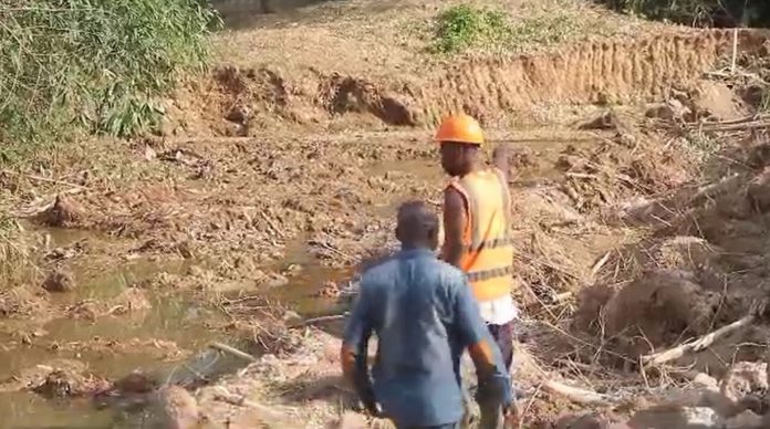 Nkawkaw MP desilts choked gutters to curb flooding