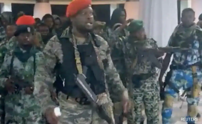 Videos on social media showed men in fatigues at the Palais de la Nation, brandishing flags of Zaire. Videos on social media showed men in fatigues at the Palais de la Nation, brandishing flags of Zaire.