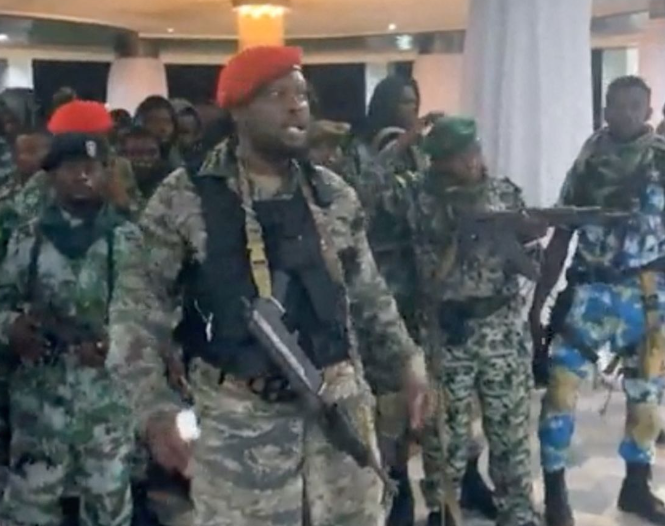 A man in military fatigues speaks as others stand next to him inside the Palace of the Nation during an attempted coup in Kinshasa, Democratic Republic of Congo, May 19, 2024, in this screen grab from a social media video. Christian Malanga/Reuters A man in military fatigues speaks as others stand next to him inside the Palace of the Nation during an attempted coup in Kinshasa, Democratic Republic of Congo, May 19, 2024, in this screen grab from a social media video. Christian Malanga/Reuters