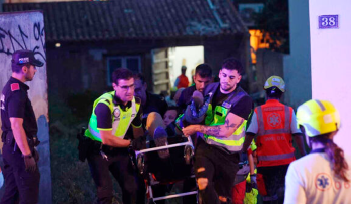 Medics taking injured people from a building that collapsed in Playa de Palma on the Spanish Mediterranean island of Mallorca. Picture: Isaac Buj/Europa Press/AP Medics taking injured people from a building that collapsed in Playa de Palma on the Spanish Mediterranean island of Mallorca. Picture: Isaac Buj/Europa Press/AP