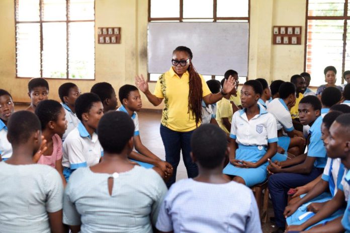 MTN staff volunteer engaging with students of Christ the King SHS in the Ashanti region MTN staff volunteer engaging with students of Christ the King SHS in the Ashanti region