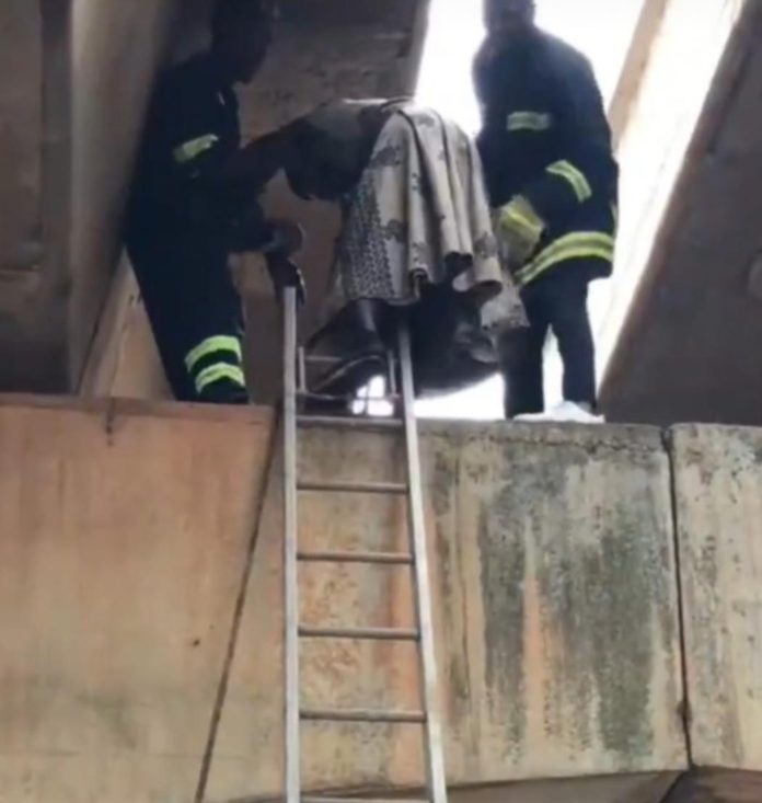 Firemen rescue mentally unstable man trapped on Suhum overpass pillar