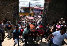 Political assassinations in Mexico: 34 candidates murdered amid election People carry a coffin that contains the remains of a man slain in a mass shooting into a church for a funeral service in Huitzilac, Mexico, on May 14. Fernando Llano/AP