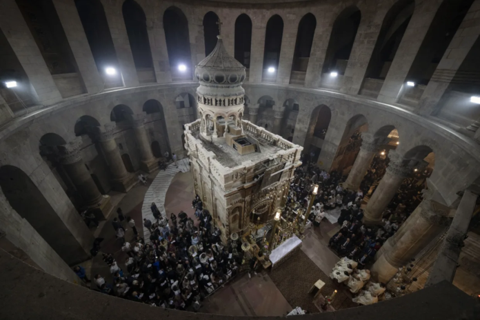Latin Patriarch of Jerusalem Pierbattista Pizzaballa leads the Easter Sunday Mass at the Church of the Holy Sepulchre, where many Christians believe Jesus was crucified, buried and rose from the dead, in the Old City of Jerusalem, Sunday, March 31, 2024. The heads of major Christian denominations in Israel say that local governments across the country are demanding they pay property tax, violating a longstanding arrangement in a manner they say reflects growing intolerance for Christians in the Holy Land. (AP Photo/Leo Correa, File) Latin Patriarch of Jerusalem Pierbattista Pizzaballa leads the Easter Sunday Mass at the Church of the Holy Sepulchre, where many Christians believe Jesus was crucified, buried and rose from the dead, in the Old City of Jerusalem, Sunday, March 31, 2024. The heads of major Christian denominations in Israel say that local governments across the country are demanding they pay property tax, violating a longstanding arrangement in a manner they say reflects growing intolerance for Christians in the Holy Land. (AP Photo/Leo Correa, File)