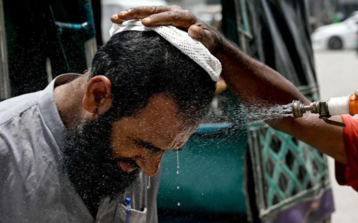 Getty Images In Karachi, a man has his face sprayed on to cool off during a heat wave Getty Images In Karachi, a man has his face sprayed on to cool off during a heat wave