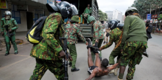 Police officers detain a man during a demonstration over police killings of people protesting against Kenya's finance bill, in Nairobi, Kenya, on June 27, 2024. Monicah Mwangi/Reuters