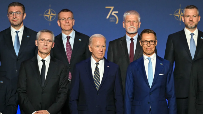 President Joe Biden, flanked by NATO Secretary General Jens Stoltenberg, left, and President of Finland Alexander Stubbs, right, stands with NATO leaders for a group photo during the NATO 75th Anniversary Celebratory Event at the Mellon Auditorium in Washington, DC, on July 9. Saul Loeb/AFP/Getty Images President Joe Biden, flanked by NATO Secretary General Jens Stoltenberg, left, and President of Finland Alexander Stubbs, right, stands with NATO leaders for a group photo during the NATO 75th Anniversary Celebratory Event at the Mellon Auditorium in Washington, DC, on July 9. Saul Loeb/AFP/Getty Images