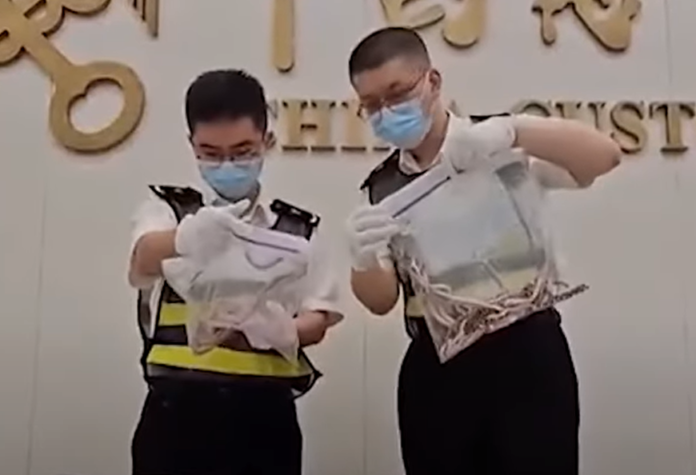 Man in China caught smuggling 100 live snakes in his trousers Man in China caught smuggling 100 live snakes in his trousers