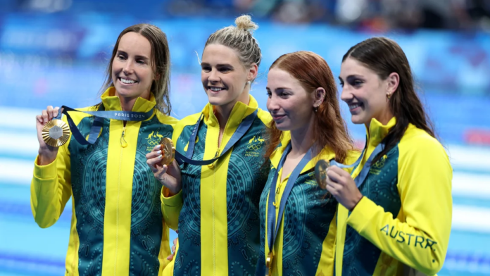 Team Australia pose with their medals after winning the Women's 4x100m Freestyle Relay Final in Paris on July 27, 2024. Al Bello/Getty Images