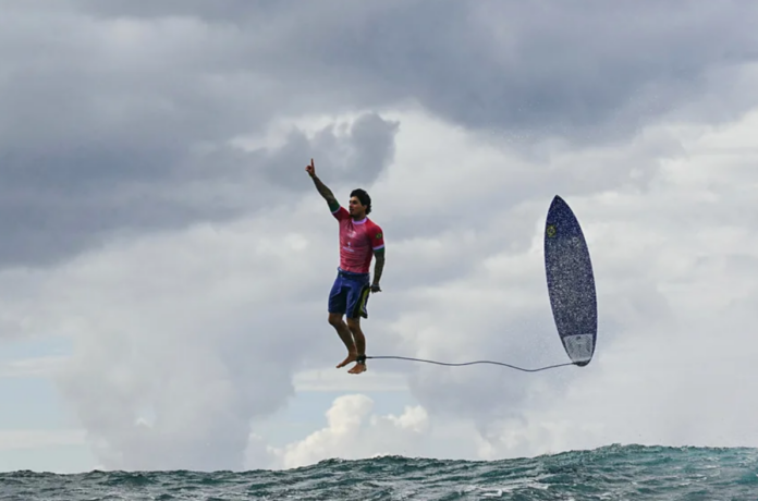image_2024-08-12_015442621 Brazil's Gabriel Medina reacts after getting a large wave in the 5th heat of the men's surfing round three in Teahupo'o during the Paris 2024 Olympic Games (Credit: Getty Images)