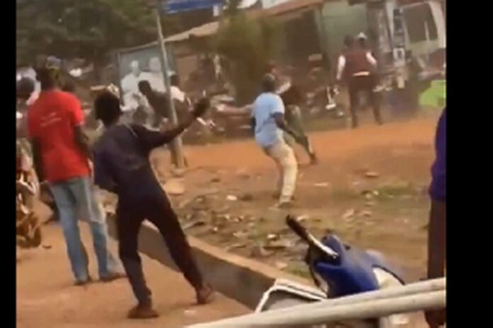 Some members of NPP and NDC pelting stones at each other Some members of NPP and NDC pelting stones at each other