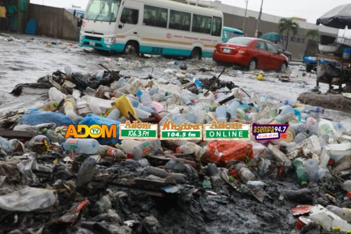 A sea of plastic waste engulfs Darkuman junction’s floodwaters in Accra