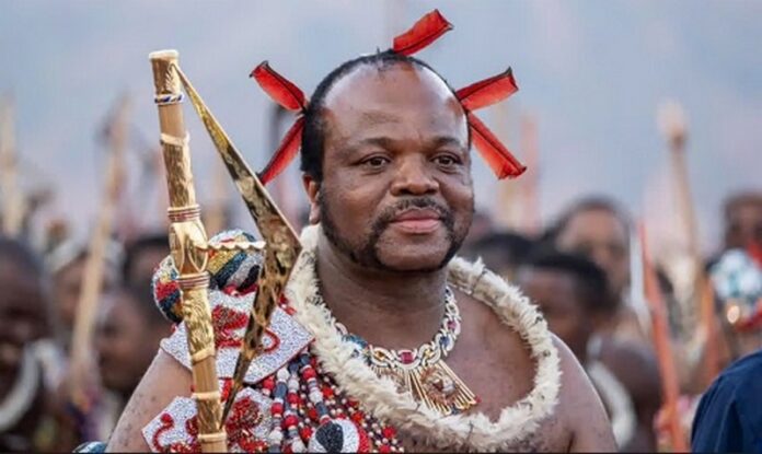 King Mswati III, who took the throne in 1986, arrives in ceremonial dress for the annual reed dance King Mswati III, who took the throne in 1986, arrives in ceremonial dress for the annual reed dance