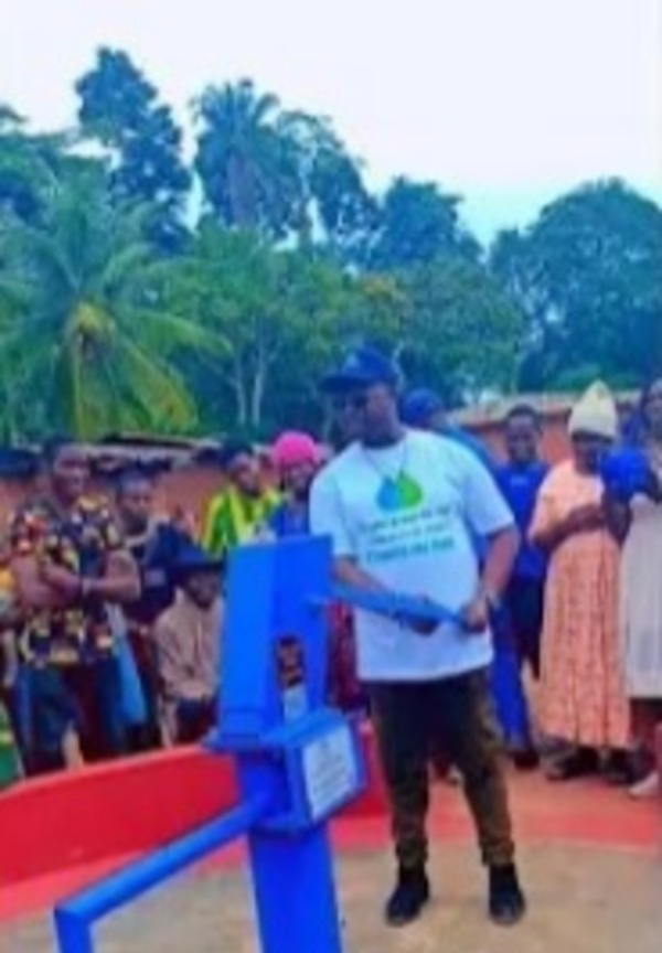 Man pumping borehole