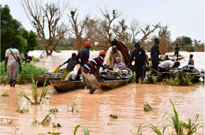 In Niger, people were forced to use canoes after heavy rains damaged main roads. In Niger, people were forced to use canoes after heavy rains damaged main roads.