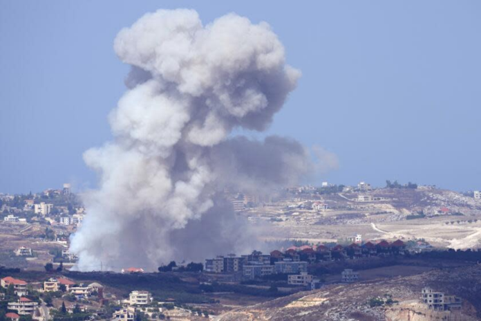 Smoke from Israeli airstrikes on villages in the Nabatiyeh district is visible Monday from the southern town of Marjayoun, Lebanon. (Hussein Malla / Associated Press) Smoke from Israeli airstrikes on villages in the Nabatiyeh district is visible Monday from the southern town of Marjayoun, Lebanon. (Hussein Malla / Associated Press)