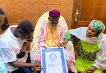 GWR holder, Abdul Hakim Awal presents certificate to Chief Imam