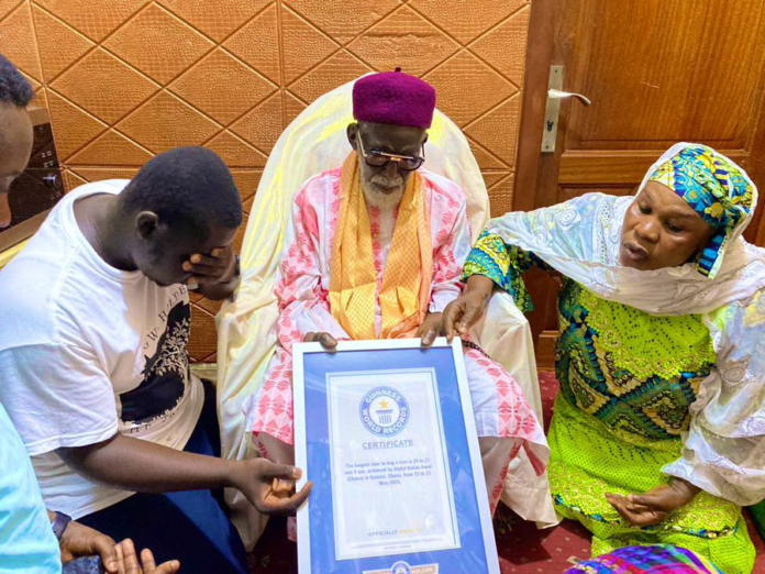 GWR holder, Abdul Hakim Awal presents certificate to Chief Imam