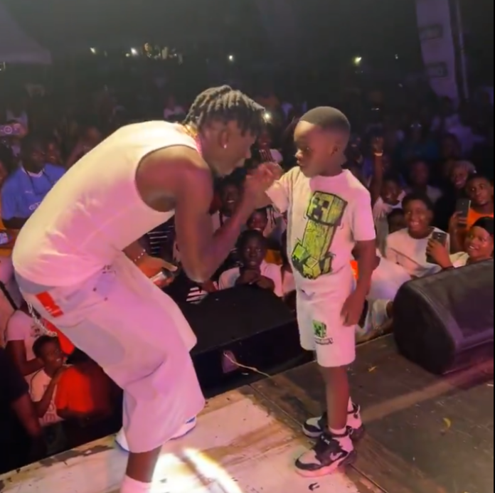 Stonebwoy and young fan at Adom Kolor Paaty