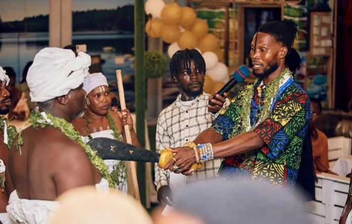 Mzbel signs new artiste with schnapps, oath-taking ceremony