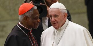 Cardinal Peter Appiah Turkson (L) with Pope Francis