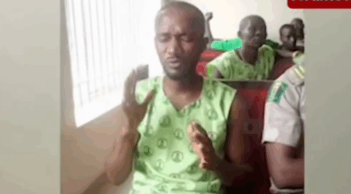 Timilehin Ajayi praying in court